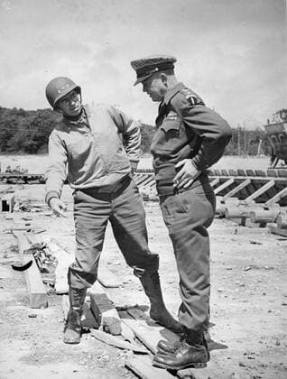 RECORD DATE NOT STATED General Dwight D. Eisenhower, Supreme Commander-in-Chief Allied Expeditionary Force, examines a flying bomb site which was captured by US troops somewhere along the Normandy Coast. Lt. Gen. Omar Bradley, Commander of the First US Army, points out a feature of the construction. France, July 1944. 1063_05_Eisenhower_and_Bradley_examine_German_Flying_Bomb_Site