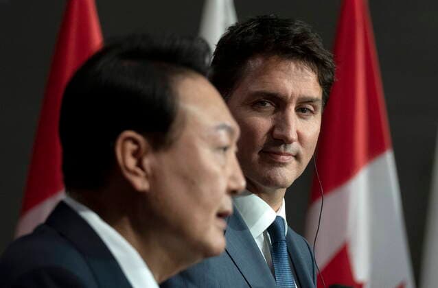 September 23, 2022, Ottawa, ON, Canada: Canadian Prime Minister Justin Trudeau listens to South Korean President Yoon Suk Yeol as he speaks during a joint news conference, in Ottawa, Friday, Sept. 23, 2022. Ottawa Canada  - ZUMAc35_ 20220923_zaf_c35_100 Copyright: xAdrianxWyldx