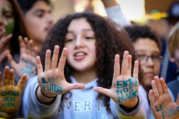September 23, 2022, Montreal, Quebec, Canada: Thousands of protesters gathered for a climate march, demanding more action on climate change from elected officials. The event was part of the Fridays for Future Movement, an international, youth-led initiative inspired by Swedish activist Greta Thunberg. Some protesters showed their hands where the following quote was written: The future is in our hands. Montreal Canada - ZUMAs278 20220923_zip_s278_006 Copyright: xSerkanxSenturkx