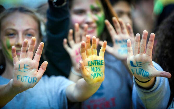 September 23, 2022, Montreal, Quebec, Canada: Thousands of protesters gathered for a climate march, demanding more action on climate change from elected officials. The event was part of the Fridays for Future Movement, an international, youth-led initiative inspired by Swedish activist Greta Thunberg. Some protesters showed their hands where the following quote was written: The future is in our hands. Montreal Canada - ZUMAs278 20220923_zip_s278_025 Copyright: xSerkanxSenturkx