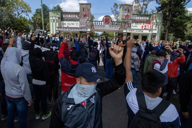 September 23, 2022, Mexico City, Mexico: Ayotzinapa students and members of civil associations, take part during confrontations against the police causing disturbances at the entrance of Military Zone 1 as part of the National Day of Struggle, demanding justice for the forced disappearance of the 43 students of the Rural Normal School of Ayotzinapa, 8 years after the massacre of the Students of Ayotzinapa. on September 23, 2022, Mexico City, Mexico. Mexico City Mexico - ZUMAe321 20220923_zia_e321_022 Copyright: xAlexxDaltonxEyepixxGroupx