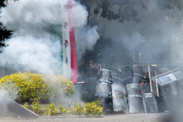 September 23, 2022, Mexico City, Mexico: Ayotzinapa students and members of civil associations, take part during confrontations against the police causing disturbances at the entrance of Military Zone 1 as part of the National Day of Struggle, demanding justice for the forced disappearance of the 43 students of the Rural Normal School of Ayotzinapa, 8 years after the massacre of the Students of Ayotzinapa. on September 23, 2022, Mexico City, Mexico. Mexico City Mexico - ZUMAe321 20220923_zia_e321_023 Copyright: xAlexxDaltonxEyepixxGroupx