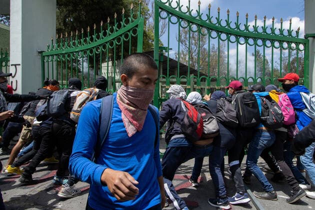 September 23, 2022, Mexico City, Mexico: Ayotzinapa students and members of civil associations, take part during confrontations against the police causing disturbances at the entrance of Military Zone 1 as part of the National Day of Struggle, demanding justice for the forced disappearance of the 43 students of the Rural Normal School of Ayotzinapa, 8 years after the massacre of the Students of Ayotzinapa. on September 23, 2022, Mexico City, Mexico. Mexico City Mexico - ZUMAe321 20220923_zia_e321_024 Copyright: xAlexxDaltonxEyepixxGroupx