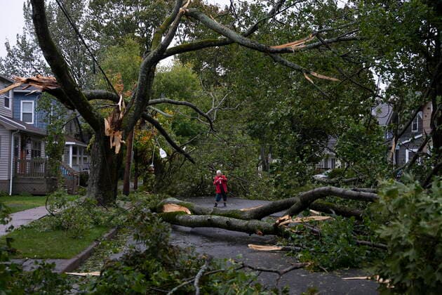 September 24, 2022, Halifax, NS, Canada: Georgina Scott surveys the damage on her street in Halifax as post tropical storm Fiona continues to batter the Maritimes on Saturday, September 24, 2022. Halifax Canada  - ZUMAc35_ 20220924_zaf_c35_003 Copyright: xDarrenxCalabresex