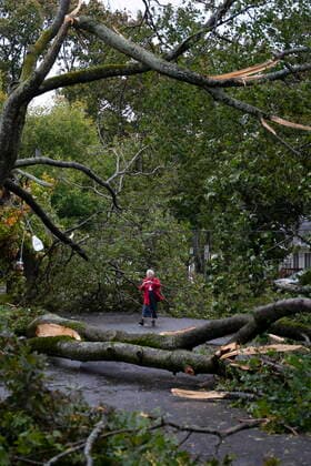 September 24, 2022, Halifax, NS, Canada: Georgina Scott surveys the damage on her street in Halifax as post tropical storm Fiona continues to batter the Maritimes on Saturday, September 24, 2022. Halifax Canada - ZUMAc35_ 20220924_zaf_c35_005 Copyright: xDarrenxCalabresex