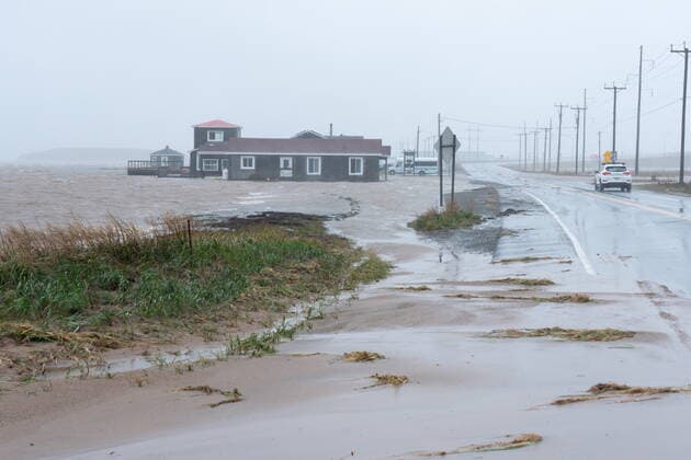 September 24, 2022, Žles-de-la-Madeleine, Que, CANADA: Youth hostel Paradis Bleu is surrounded by high water caused by post-tropical storm Fiona is shown on the Les ÃŽles-de-la-Madeleine, Que., Saturday, Sept. 24, 2022. Coastal flooding remains a threat for parts of Nova Scotia, Prince Edward Island including the Northumberland Strait, the Gulf of St. Lawrence region including Iles-de-la-Madeleine and eastern New Brunswick, southwest Newfoundland, the St. Lawrence Estuary and the Quebec Lower North Shore. Îles-de-la-Madeleine CANADA  - ZUMAc35_ 20220924_zaf_c35_063 Copyright: xNigelxQuinnx