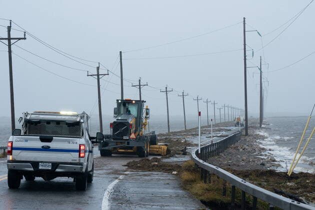 September 24, 2022, Žles-de-la-Madeleine, Que, CANADA: Highway crews clean debris caused by post-tropical storm Fiona on the Les ÃŽles-de-la-Madeleine, Que., Saturday, Sept. 24, 2022. Coastal flooding remains a threat for parts of Nova Scotia, Prince Edward Island including the Northumberland Strait, the Gulf of St. Lawrence region including Iles-de-la-Madeleine and eastern New Brunswick, southwest Newfoundland, the St. Lawrence Estuary and the Quebec Lower North Shore. Îles-de-la-Madeleine CANADA  - ZUMAc35_ 20220924_zaf_c35_065 Copyright: xNigelxQuinnx