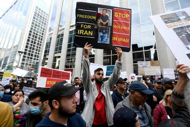 September 25, 2022, Ottawa, ON, CAN: Members of the Iranian community and their supporters rally in solidarity with protesters in Iran, after 22-year-old Mahsa Amini died in police custody for allegedly improperly wearing a hijab, in Ottawa on Sunday, Sept. 25, 2022. Ottawa CAN  - ZUMAc35_ 20220925_zaf_c35_033 Copyright: xJustinxTangx