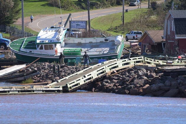 September 25, 2022, Stanley Bridge, PEI, Canada: A lobster boat grounded on the rocks at the wharf in Stanley Bridge, P.E.I. on Sunday September 25, 2022. After hammering Atlantic Canada, post-tropical storm Fiona has moved inland in southeastern Quebec, with Environment Canada saying the storm will continue to weaken as it tracks across southeastern Labrador and over the Labrador Sea. Stanley Bridge Canada  - ZUMAc35_ 20220925_zaf_c35_103 Copyright: xBrianxMcinnisx