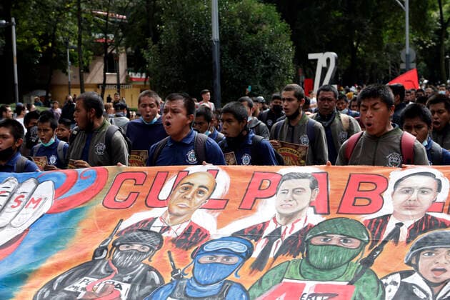 September 26, 2022, Mexico City, Mexico: Ayotzinapa students take part during the demonstration to demnad justice for the crime as part of the 8th anniversary of the forced disappearance of the 43 normalistas of Ayotzinapa Zocalo in Mexico City. on September 26, 2022 in Mexico City, Mexico. Mexico City Mexico - ZUMAe321 20220926_zia_e321_053 Copyright: xLuisxBarronxEyepixxGroupx