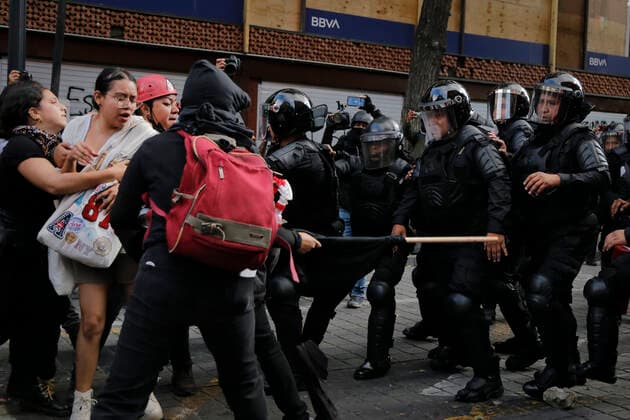 September 26, 2022, Mexico, Mexico: Protesters clash with police officers during a demonstration to commemorate the 8th anniversary of the disappearance of the 43 Ayotzinapa students. On the night of September 26, 2014, 43 students from the Raoel Isidro Burgos Rural Normal School located in Iguala, Guerrero, were victims of forced disappearance by members of public security from the state of Guerrero and federal military security..The students had allegedly tried to hijack trucks to use for their protests. Mexico Mexico - ZUMAs197 20220926_zaa_s197_323 Copyright: xGuillermoxDiazx