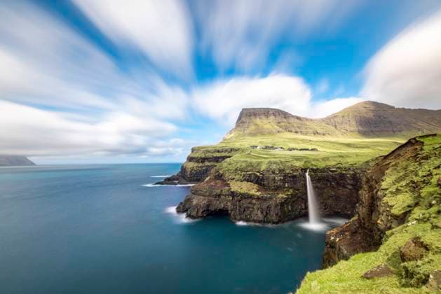 Faroe Islands, Vagar, Gasadalur, Scenic view of Mulafossur Waterfall, WPEF06267