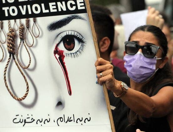 September 27, 2022, Athens, Greece: Iranian women who leaves in Athens holds placards and chant slogans during a protest over the death of 22-year-old Iranian woman Mahsa Amini after being detained by morality police in Tehran for violating hijab rules outside of Iranian enbassy in Athens. Athens Greece - ZUMAv62_ 20220927_zaf_v62_008 Copyright: xAristidisxVafeiadakisx