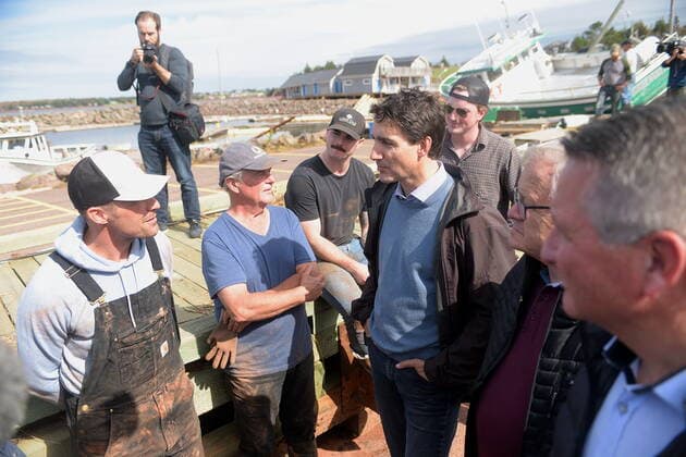 September 27, 2022, Stanley Bridge, PEI, Canada: Prime Minister Justin Trudeau speaks with Mitch Jollimore, left, lobster fisherman and business owner of StanleyöÄÃ s fish and chips and Basin View Seafood as he visits Stanley Bridge, P.E.I., to see the damage done by post-tropical storm Fiona, on Tuesday, Sept. 27, 2022. Second from right is Veterans Affairs Minister Lawrence MacAulay and at right, Liberal MP for Malpeque Heath MacDonald. Stanley Bridge Canada  - ZUMAc35_ 20220927_zaf_c35_086 Copyright: xBrianxMcinnisx
