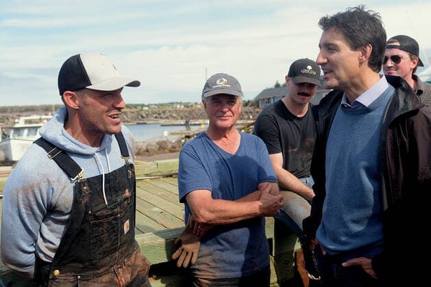September 27, 2022, Stanley Bridge, PEI, Canada: Prime Minister Justin Trudeau speaks with Mitch Jollimore, left, lobster fisherman and business owner of StanleyöÄÃ s fish and chips and Basin View Seafood as he visits Stanley Bridge, P.E.I., to see the damage done by post-tropical storm Fiona, on Tuesday, Sept. 27, 2022. Stanley Bridge Canada  - ZUMAc35_ 20220927_zaf_c35_087 Copyright: xBrianxMcinnisx