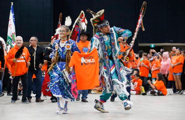 September 30, 2022, WINNIPEG, MANITOBA, CANADA: Sherry Starr and Wab Kinew lead the grand entrance at the second annual Orange Shirt Day Survivors Walk and Pow Wow on National Day for Truth and Reconciliation in Winnipeg, Friday, September 30, 2022. WINNIPEG CANADA  - ZUMAc35_ 20220930_zaf_c35_217 Copyright: xJohnxWoodsx
