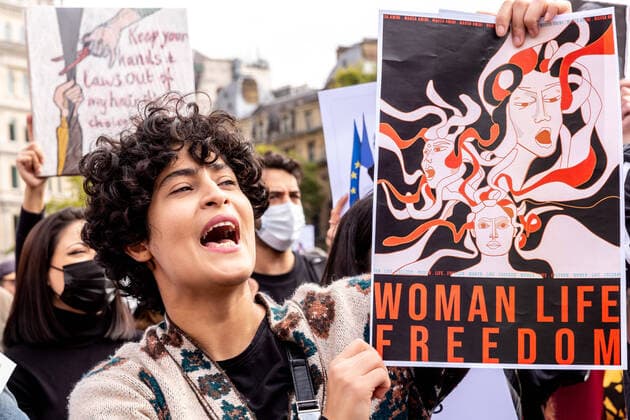October 1, 2022, London, United Kingdom: A woman chants anti-regime slogans during a demonstration in solidarity with Iranian women, as part of planned worldwide protests against the regime of the Islamic Republic of Iran after the death of Mahsa Amini. The death of Mahsa Amini, 22, from Kurdistan, who was arrested by the morality police in Tehran for not wearing her hijab correctly sent a wave of protests in Iran and across the world.. Amini was taken to a detention center where she collapsed and died later in a hospital. The reason for her death is unclear. Iranian President Ebrahim Raisi promised a transparent investigation last week. London United Kingdom - ZUMAs197 20221001_zaa_s197_177 Copyright: xDominikaxZarzyckax
