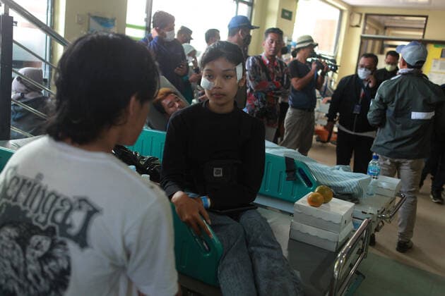 (221002) -- MALANG, Oct. 2, 2022 -- Injured people receive medical treatment at a hospital in Malang of East Java province, Indonesia, Oct. 2, 2022. The death toll in a crowd stampede at a football match in Indonesia s East Java province has reached 174 as of Sunday afternoon, according to the province s deputy governor Emil Dardak. The tragedy occurred on Saturday night at the Kanjuruhan Stadium in Malang of Indonesia s East Java province, right after Arema Malang club lost to Persebaya Surabaya in an Indonesian league football match. (Photo by Xinhua) INDONESIA-MALANG-FOOTBALL MATCH-STAMPEDE BayuxNovanta 