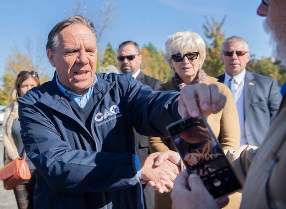 October 2, 2022, Magog, PQ, Canada: Coalition Avenir Quebec Leader Francois Legault greets a supporter during an election campaign stop at a market in Magog, Que., Sunday, October 2, 2022. Quebecers will go to the polls on Monday. Magog Canada  - ZUMAc35_ 20221002_zaf_c35_008 Copyright: xGrahamxHughesx