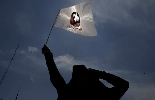 54th Anniversary Of The Tlatelolco Massacre In Mexico City A person holds a ComitÃ 68 banner while demonstrating in the Zocalo in Mexico City, on the 54th anniversary of the Tlatelolco Massacre that took place on 2 October 1968 in the square. Mexico City Mexico City Mexico  Copyright: xGerardoxVieyrax originalFilename: vieyra-notitle221002_npucA.jpg