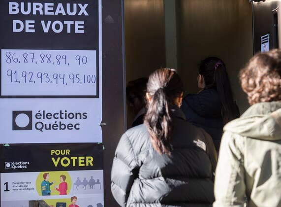 October 3, 2022, Montreal, PQ, Canada: People wait in line to vote on Quebec election day in Montreal, Monday, October 3, 2022. Montreal Canada  - ZUMAc35_ 20221003_zaf_c35_002 Copyright: xGrahamxHughesx