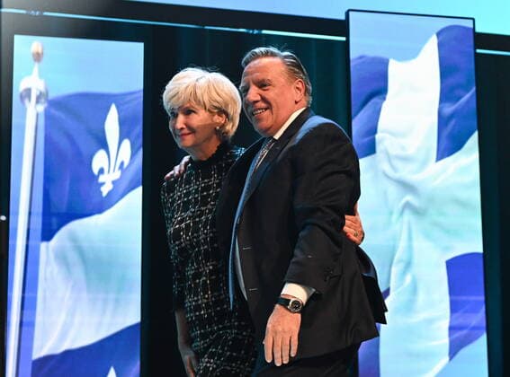 October 4, 2022, QUEBEC, PQ, Canada: Coalition Avenir Quebec Leader Francois Legault walks on the stage with his wife Isabelle Brais to speak to supporters after his victory Monday, October 3, 2022 in Quebec City. THE CANADIAN PRESS QUEBEC Canada  - ZUMAc35_ 20221004_zaf_c35_004 Copyright: xJacquesxBoissinotx