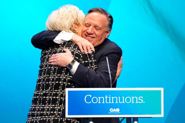 October 3, 2022, Quebec City, PQ, CANADA: CAQ Leader Francois Legault hugs and kisses his wife Isabelle Brais as he makes his victory speech to supporters at the Coalition Avenir Quebec election night headquarters in Quebec City, Monday, Oct. 3, 2022. Quebec City CANADA  - ZUMAc35_ 20221003_zaf_c35_185 Copyright: xPaulxChiassonx