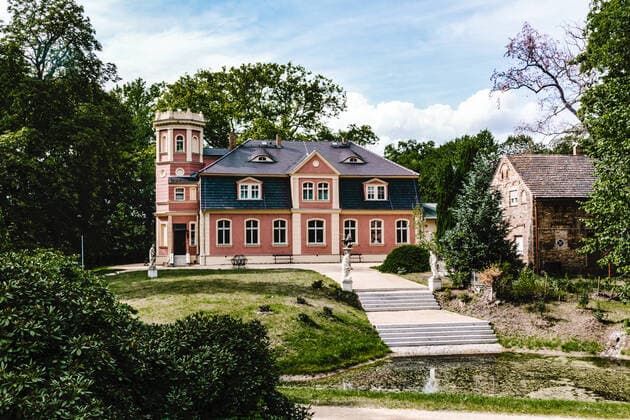 Travel Germany most beautiful places and nature parks Kromlau Castle in the Azalea and Rhododendron Landscape Park Kromlau Saxony Germany