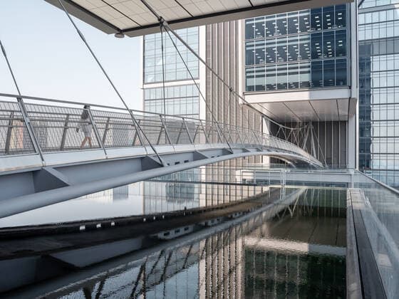 **VIDEO AVAILABLE: CONTACT INFO@COVERMG.COM TO RECEIVE** British architecture studio Foster + Partners has completed two skyscrapers - connected by an open-air suspension bridge, 105 meters above the ground - for Chinese drone manufacturer DJI in Shenzhen called DJI Sky City. DJI Sky City in Shenzen is comprised of the two 200-metre-high skyscrapers that now house the the robotics company and drone specialists DJI. The bridge is attached to each of the towers by vertically slatted cores, which both support a series of steel truss-encased, glass volumes that were stacked and cantilevered on top of one another. Its ground floor houses public facilities, including a community healthcare centre, and lobbies that each contain an indoor zen g Copyright: xx 52040751 EDITORIAL USE ONLY. NOT FOR USE BY NEWSPAPERS BASED IN THE UK.