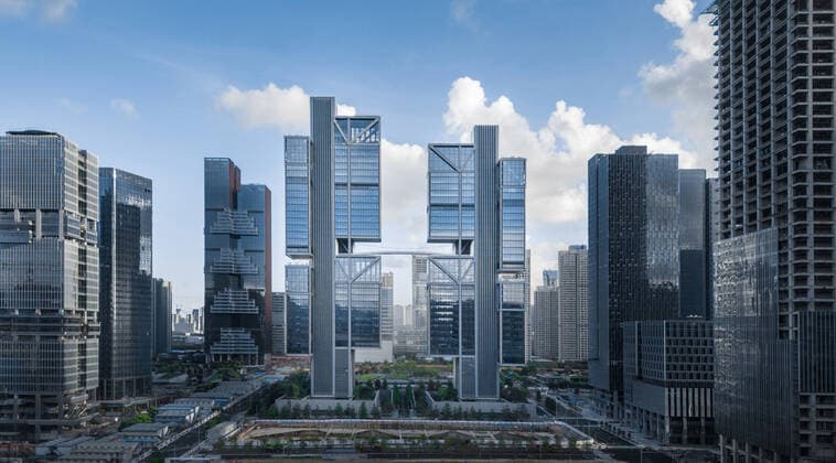 **VIDEO AVAILABLE: CONTACT INFO@COVERMG.COM TO RECEIVE** British architecture studio Foster + Partners has completed two skyscrapers - connected by an open-air suspension bridge, 105 meters above the ground - for Chinese drone manufacturer DJI in Shenzhen called DJI Sky City. DJI Sky City in Shenzen is comprised of the two 200-metre-high skyscrapers that now house the the robotics company and drone specialists DJI. The bridge is attached to each of the towers by vertically slatted cores, which both support a series of steel truss-encased, glass volumes that were stacked and cantilevered on top of one another. Its ground floor houses public facilities, including a community healthcare centre, and lobbies that each contain an indoor zen g Copyright: xx 52040740 EDITORIAL USE ONLY. NOT FOR USE BY NEWSPAPERS BASED IN THE UK.