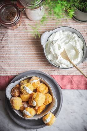 From above bowl with crunchy nun s puffs bites stuffed with cream cheese placed on table in kitchen at home PatriciaGarcia_ID929_34032_009 Copyright: xPatriciaxGarciax Model Released