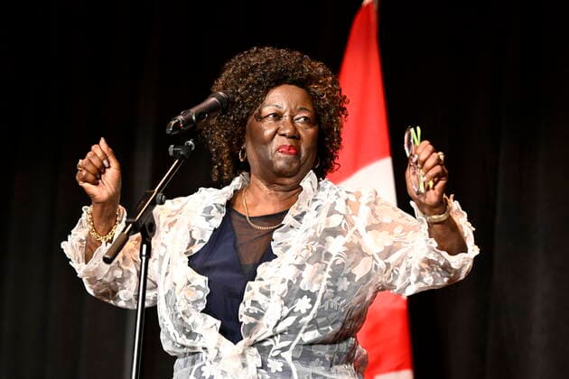 October 5, 2022, Ottawa, ON, CAN: Jean Augustine, who became the first Black female Member of Parliament in 1993 and the first Black woman in Cabinet in 2002, gestures as she steps in front of the microphone to speak after the premiere of Steadfast, a film about her life, at the National Gallery of Canada in Ottawa, on Wednesday, Oct. 5, 2022. Ottawa CAN  - ZUMAc35_ 20221005_zaf_c35_051 Copyright: xJustinxTangx