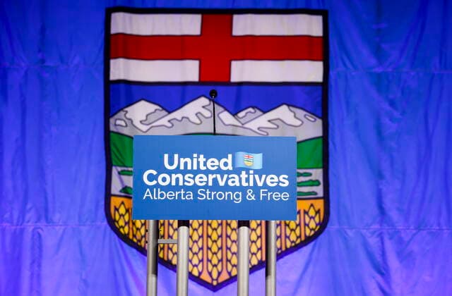 October 6, 2022, Calgary, AB, CANADA: A United Conservative Party of Alberta s sign is shown in front of the Alberta flag prior to the party s leadership announcement in Calgary, Alta., Thursday, Oct. 6, 2022. Calgary CANADA  - ZUMAc35_ 20221006_zaf_c35_138 Copyright: xJeffxMcintoshx