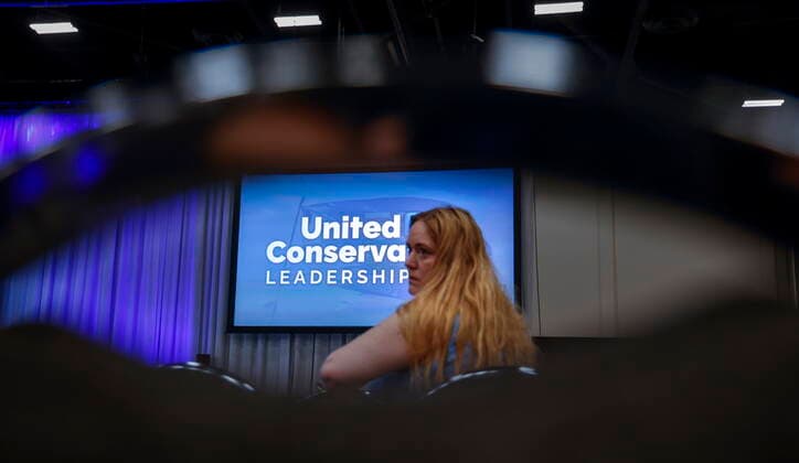 October 6, 2022, Calgary, AB, CANADA: A woman waits for the United Conservative Party of Alberta s leadership announcement in Calgary, Alta., Thursday, Oct. 6, 2022. Calgary CANADA  - ZUMAc35_ 20221006_zaf_c35_140 Copyright: xJeffxMcintoshx