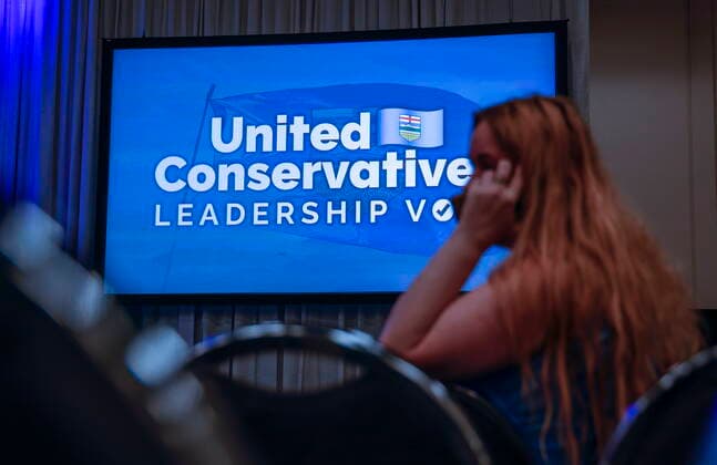October 6, 2022, Calgary, AB, CANADA: A woman waits for the United Conservative Party of Alberta s leadership announcement in Calgary, Alta., Thursday, Oct. 6, 2022. Calgary CANADA  - ZUMAc35_ 20221006_zaf_c35_141 Copyright: xJeffxMcintoshx