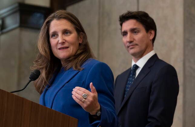 October 7, 2022, Ottawa, ON, Canada: Canadian Prime Minister Justin Trudeau looks on as ..Deputy Prime Minister and Finance Minister Chrystia Freeland speaks after announcing sanctions on Iran, in Ottawa, Friday, Oct. 7, 2022. Ottawa Canada  - ZUMAc35_ 20221007_zaf_c35_043 Copyright: xAdrianxWyldx