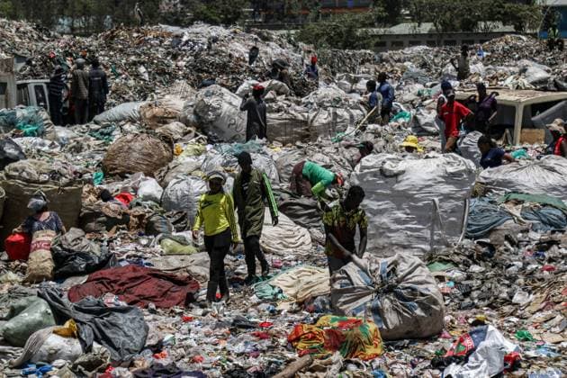 October 11, 2022, Nairobi, Kenya: Scavengers are seen working at Dandora Dumping Site. There are concerns that smoke from burning garbage emits toxic chemicals that pose environmental and public health problems. Scavengers and the community bordering landfills where waste is openly burnt are heavily affected. Nairobi Kenya - ZUMAs197 20221011_zab_s197_073 Copyright: xJamesxWakibiax