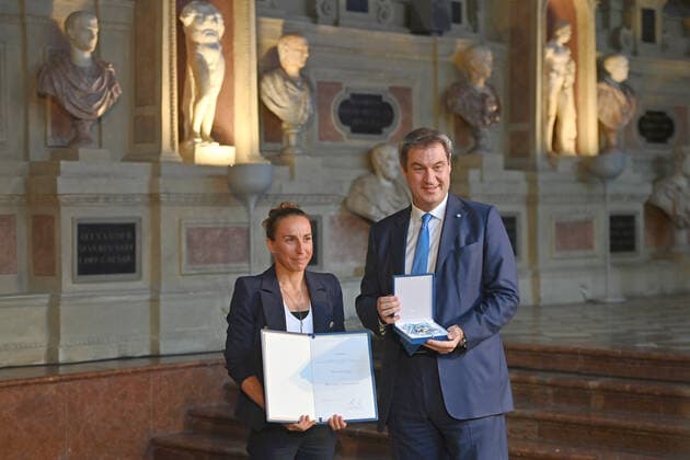 Anne HAUG Triathlete receives the Bavarian Order of Merit from Markus SOEDER State Premier of Bavaria and CSU Chairman Award of the Bavarian Order of Merit in the Antiquarium of the Munich Residence on 13 10 2022