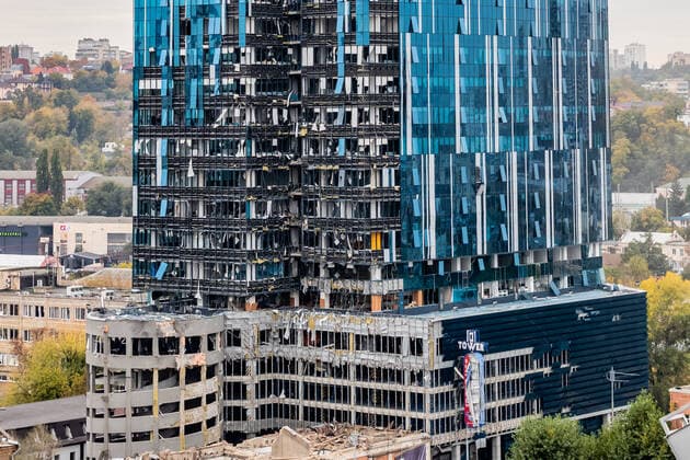 Windows and facade remain ripped apart while part of the rubble is cleared from the 101 Tower, in a parallel shot 3 days after Russian forces struck the capital Kyiv, Ukraine, photographed on Thursday, Oct 13, 2022. Blasts rock capital Kyiv and other cities, in what Ukraine says, an attack to wipe us off the face of the earth. (VX Photo Vudi Xhymshiti), Russian Missile Hit Kyiv Kyiv 101 Tower Kyiv Region Ukraine  , Copyright: xVudixXhymshitix