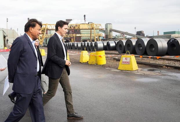 October 13, 2022, HAMILTON, ON, CANADA: Canadian Prime Minister Justin Trudeau, right, walks with ArcelorMittal Dofasco Executive chairman Lakshmi Mittal as they tour the ArcelorMittal Dofasco steel hot mill as the facility recently upgraded its manufacturing operations in Hamilton, Ont., Thursday, Oct. 13, 2022. HAMILTON CANADA  - ZUMAc35_ 20221013_zaf_c35_043 Copyright: xNathanxDenettex