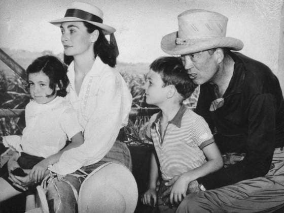RECORD DATE NOT STATED John Huston (1906-1987), American film director and actor, 1957. Huston is seen here with his wife Ricki Soma, daughter Angelica and son Tony (possibly during the filming of Heaven Knows, Mr. Allison). John Huston (1906-1987), American film director and actor, 1957. Artist: Unknown 