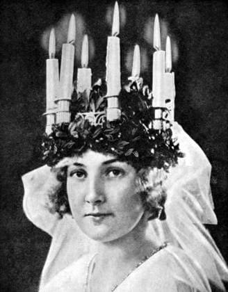 RECORD DATE NOT STATED Scandinavian girl wearing candle headdress on St Lucy s Day, 1936. The Santa Lucia festival, also known as St Lucy s Day, is a Christian event based on Viking custom and takes place on December 13. From Peoples of the World in Pictures, edited by Harold Wheeler, published by Odhams Press Ltd (London, 1936). Scandinavian girl wearing candle headdress on St Lucy s Day, 1936.Artist: Fox 