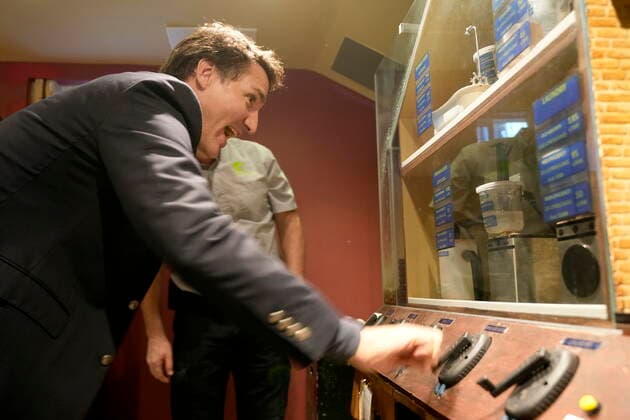 October 14, 2022, Kitchener, ON, CANADA: Prime Minister Justin Trudeau looks at a model of a home during a tour of Reep Green Solutions in Kitchener, Ont., Friday, Oct. 14, 2022. Kitchener CANADA  - ZUMAc35_ 20221014_zaf_c35_051 Copyright: xFrankxGunnx