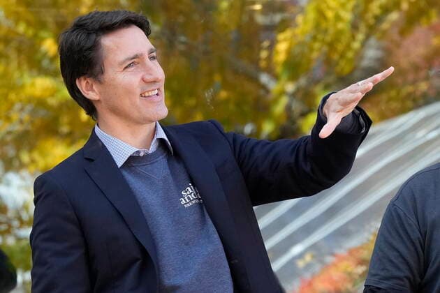 October 14, 2022, Kitchener, ON, CANADA: Prime Minister Justin Trudeau looks at a solar installation, which can be seen in a reflection in the background, during a tour of Reep Green Solutions in Kitchener, Ont., Friday, Oct. 14, 2022. Kitchener CANADA  - ZUMAc35_ 20221014_zaf_c35_053 Copyright: xFrankxGunnx