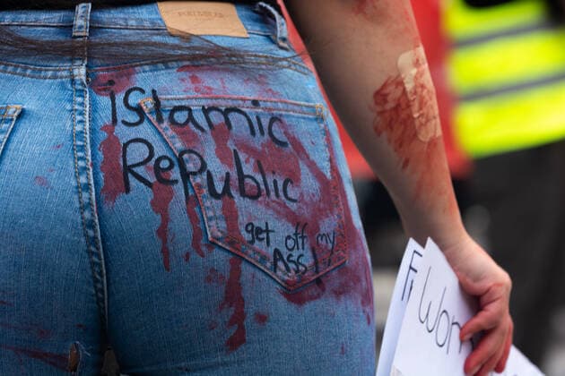News Themen der Woche KW41 News Bilder des Tages Anti Iran Regime Protest Continues In Cologne a women writes Islamic republic get off my ass is seen on her jeans during the demostration in Cologne, Germany on Oct 15, 2022 to support the Iraian people after the death of Mahsa Amini Cologne Germany  Copyright: xYingxTangx originalFilename: tang-notitle221015_np5Ia.jpg