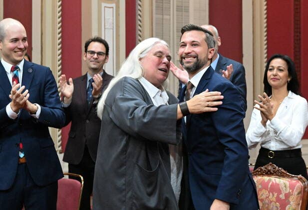 October 19, 2022, QUEBEC, PQ, Canada: Quebec Solidaire Leader Gabriel Nadeau-Dubois, right, gets a hug from co-spokesperson Manon Masse, Wednesday, October 19, 2022 during a ceremony where he swore allegiance to the people of Quebec but refused to swear allegiance to King Charles III, at the Quebec legislature. Members of Quebec Solidaire will not be able to sit at the legislature until a decision from the government is rendered. THE CANADIAN PRESS QUEBEC Canada  - ZUMAc35_ 20221019_zaf_c35_069 Copyright: xJacquesxBoissinotx