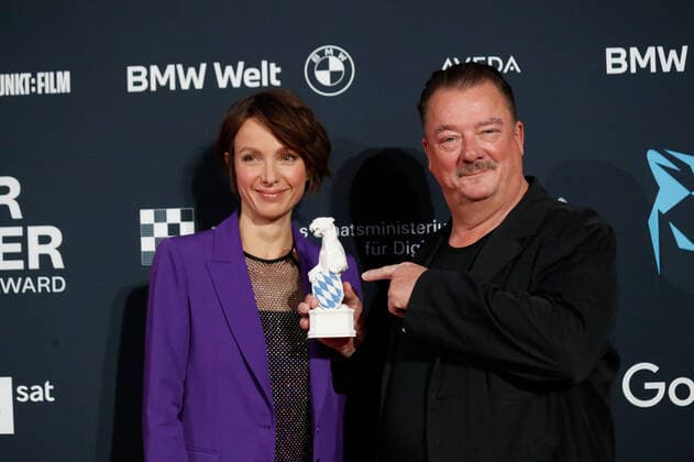 Blue Panther TV Streaming Award ceremony in Munich Laudator Julia Koschitz and award winner Peter Kurth at the Blue Panther Bavarian Television Award ceremony at the BMW Welt in Munich. Copyright: xEventpressxGolejewskix