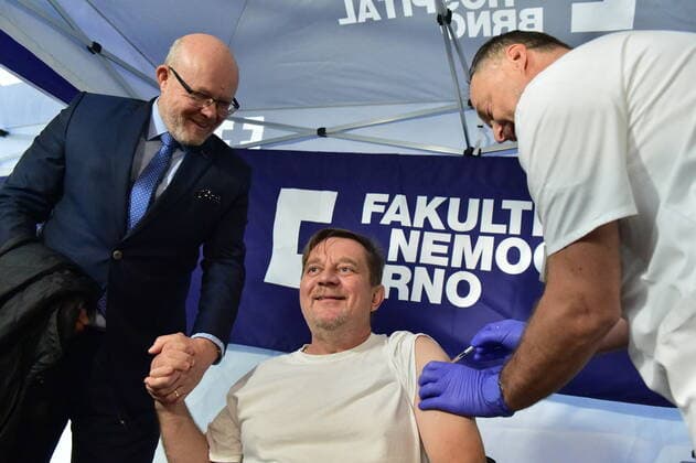 Czech Health Minister Vlastimil Valek (TOP 09), left, gives press conference on COVID-19 vaccination campaign We get vaccinated for life without fear in Brno University Hospital. Czech actor and comedian Petr Ctvrnicek receives COVID-19 vaccination in Brno University Hospital, Czech Republic, October 24, 2022. (CTKxPhoto VaclavxSalek) CTKPhotoP2022102402596 