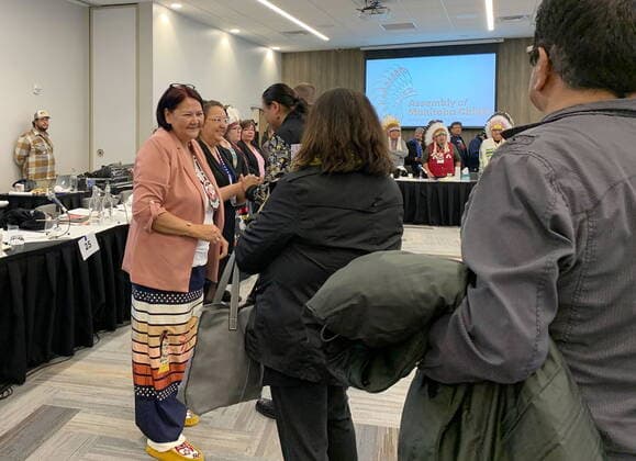 October 26, 2022, Winnipeg, MB, CANADA: Newly elected Grand Chief Cathy Merrick, second left, of the Assembly of Manitoba Chiefs greets people shortly after First Nations chiefs in the province voted her as the next leader of the advocacy organization in Winnipeg on Wednesday Oct. 26, 2022. Chiefs in Manitoba have elected the first female leader of one of the largest First Nations advocacy groups in the province. THE CANADIN PRESS Winnipeg CANADA  - ZUMAc35_ 20221026_zaf_c35_098 Copyright: xBrittanyxHobsonx
