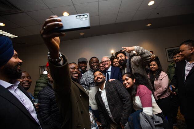 October 26, 2022, Winnipeg, MB, Canada: Ayodele Odeyemi, left, and supporters take a selfie with Scott Gillingham as people celebrate in Winnipeg, on Wednesday, October 26, 2022, following Gillingham™s win in the city™s mayoral election. Winnipeg Canada  - ZUMAc35_ 20221026_zaf_c35_165 Copyright: xDanielxCrumpx